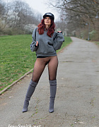 Jeny walks outdoors without a skirt, wearing only seamless dot patterned pantyhose to cover her legs.