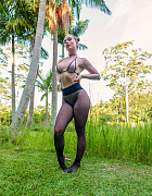 Blonde beauty in seamless black pantyhose gets her wet pussy fucked hard outdoors amid lush greenery, sheer nylon stretched tight around the thick cock thrusting deep.