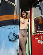 Nude teen girl wearing only little panties under sheer grey pantyhose takes a pics in a railway carriage